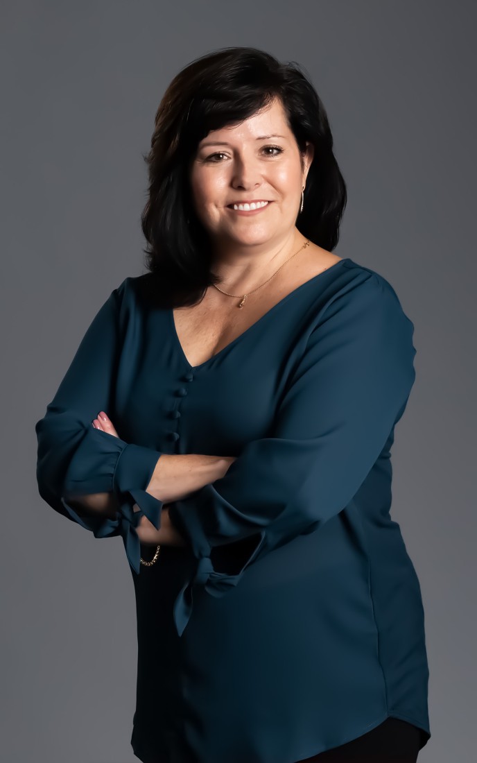 Monique Kurkowski's smiling face - Leader at Sage Solutions Group